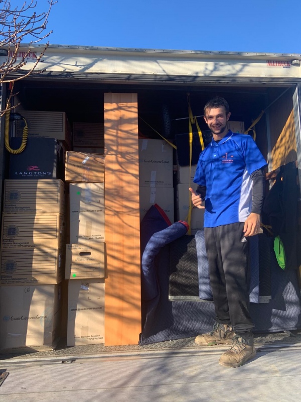 Two Truckmen removalists with a truck