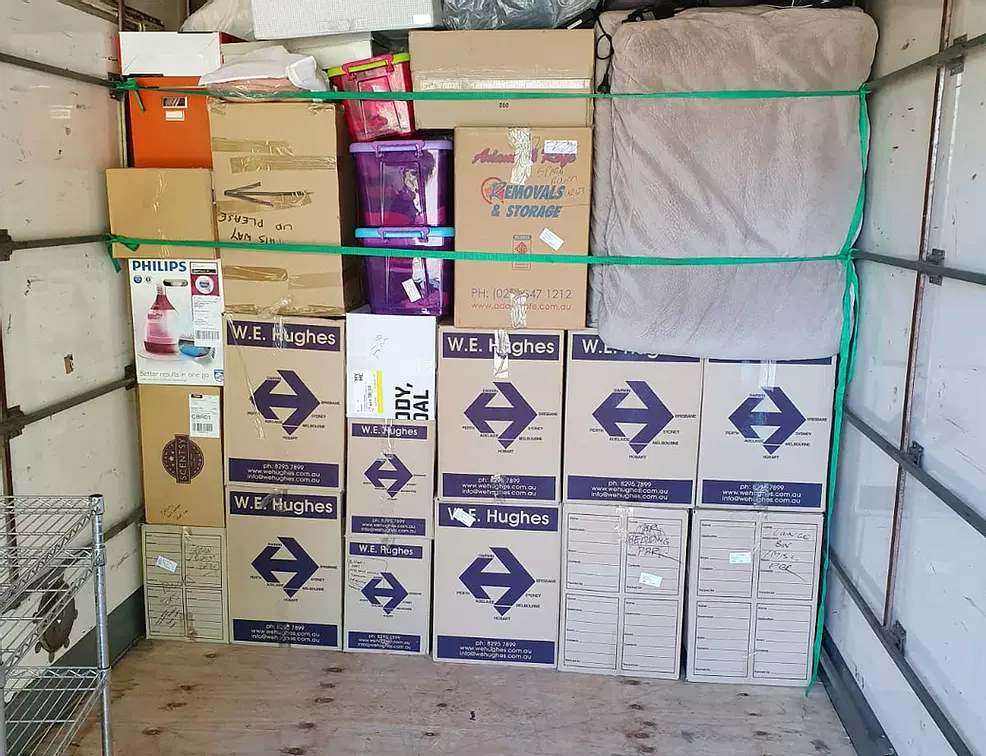 Truckmen removalists loading a truck for an interstate move